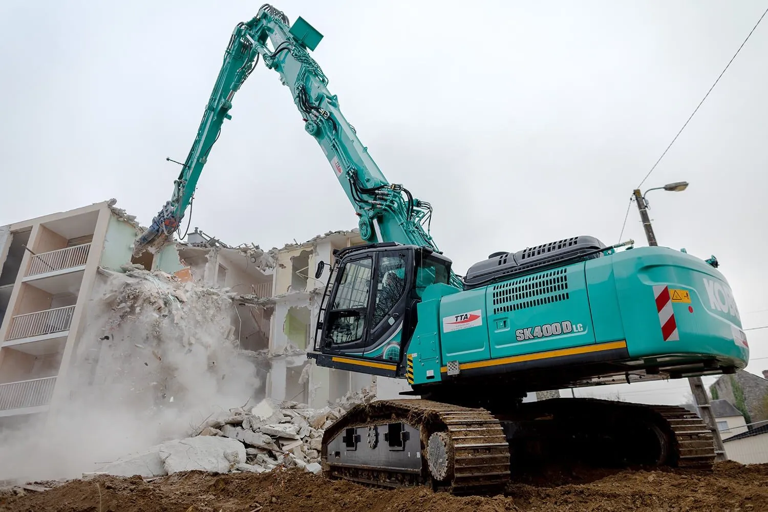 Excavator and demolition equipment at construction site